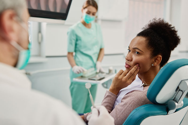 dental patient talking to dentist about periodontal disease