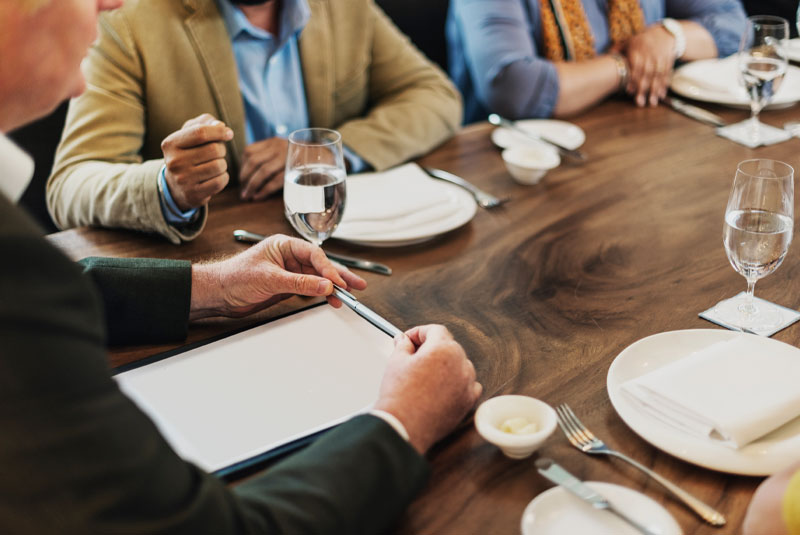 dentist and workers getting together to discuss topics