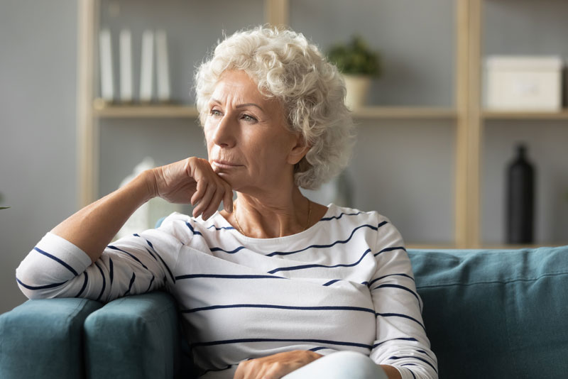 a dental implant patient thinking about a dental implant procedure