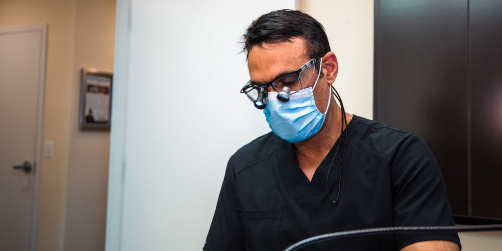 Dr. Singh performing a dental implants procedure